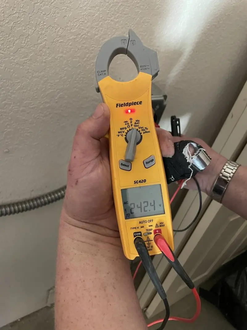 Voltage testing with clamp meter during Circuit Breaker Repair in Dryden